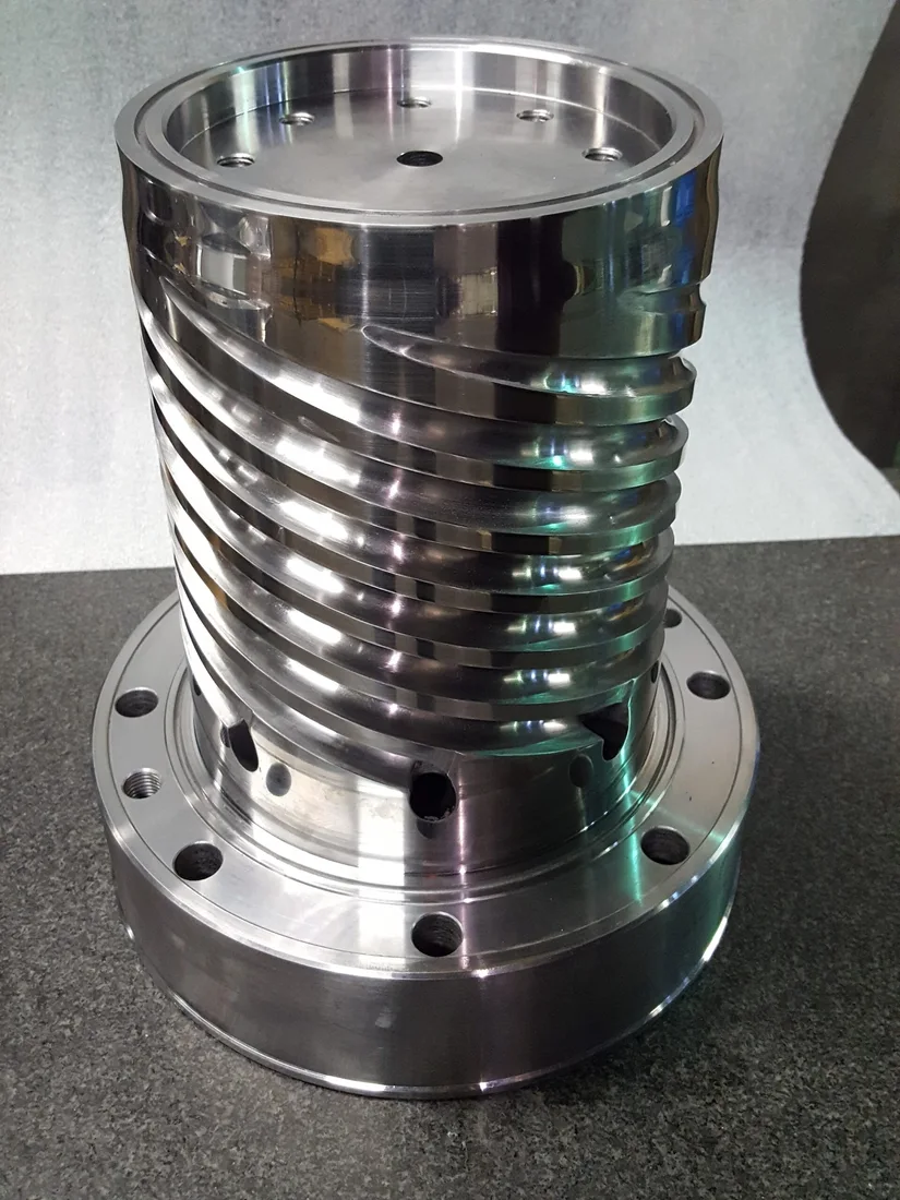 Metal spiral mandrel with flange and machined flow channels